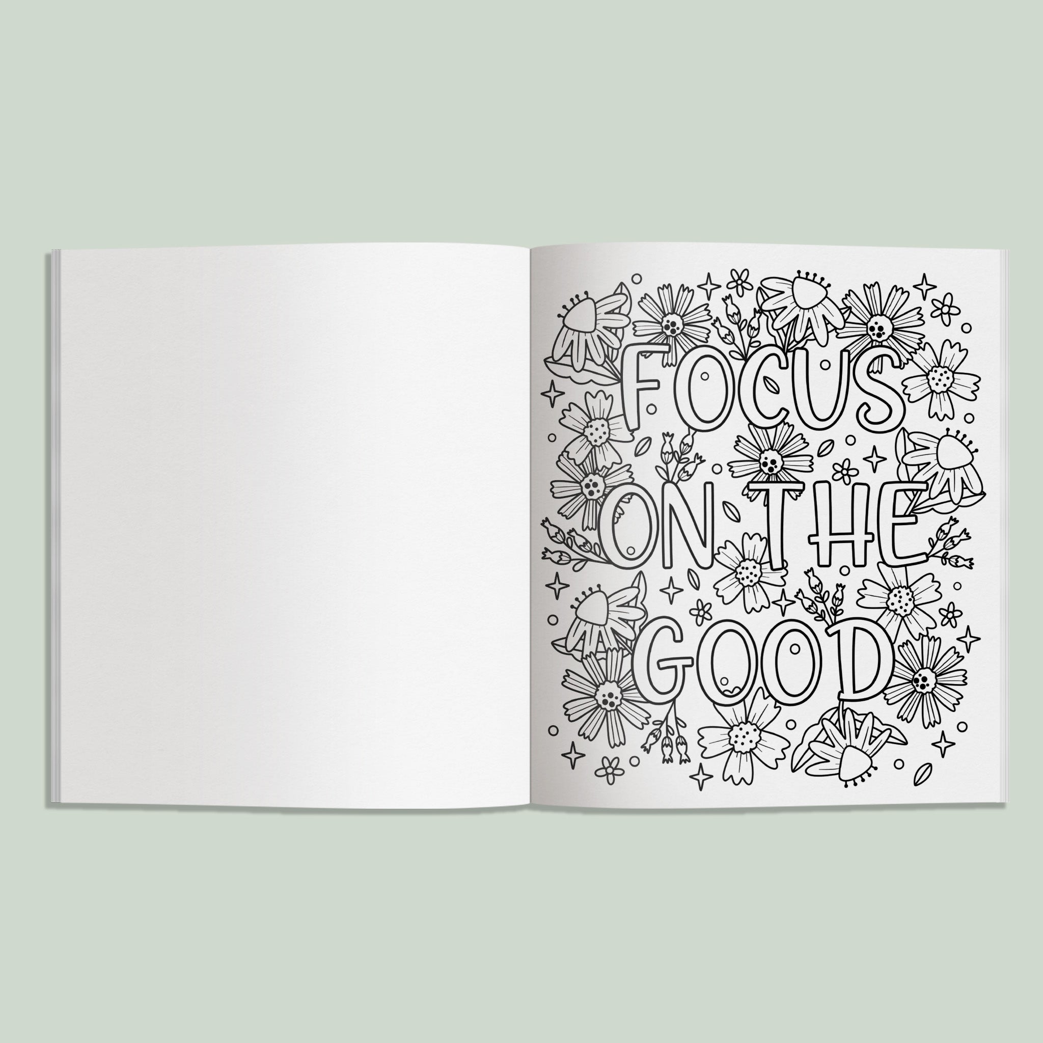 Open book with 'Focus on the Good' text and floral designs on a light green background